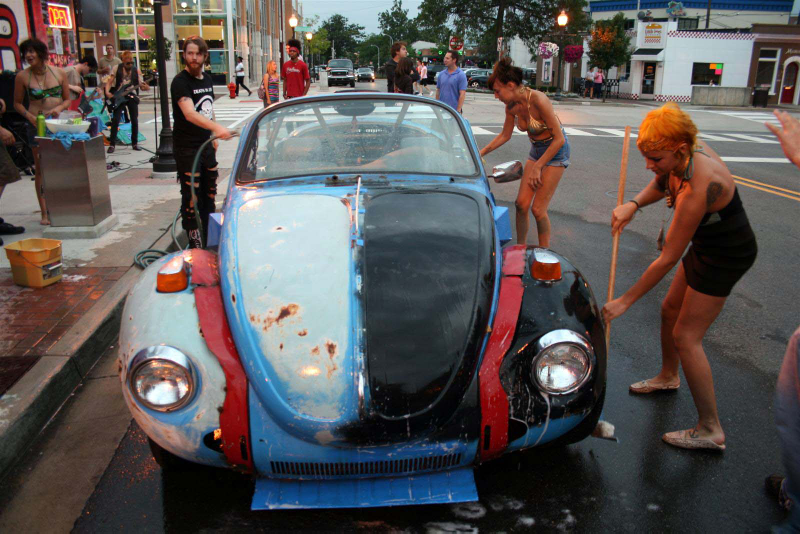 Illustration for article titled Noir Leather Bikini Car Wash Meetup Pictures